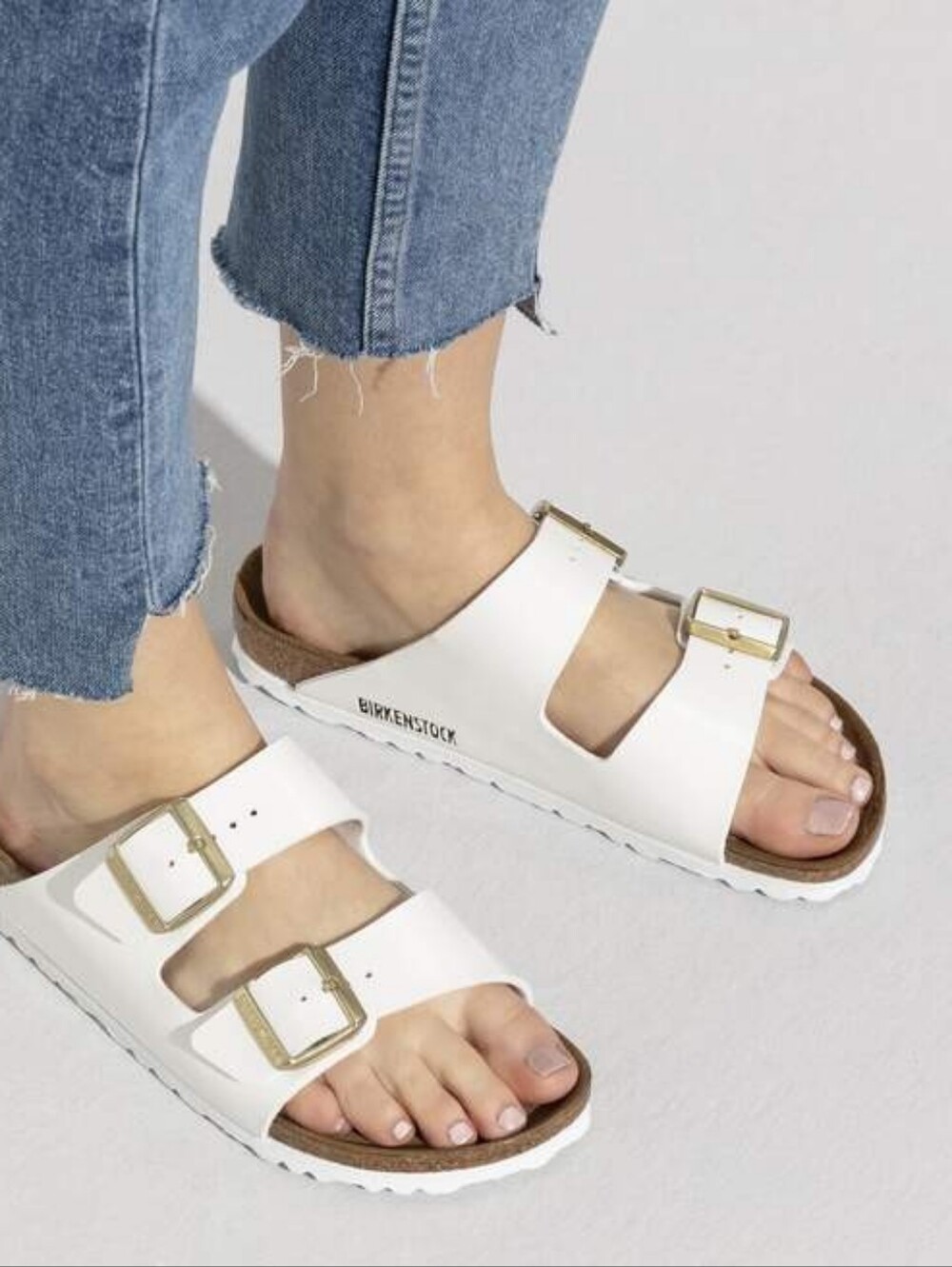 Birkenstock White Arizona Two-Strap Sandal with Gold Buckles
